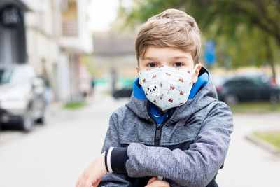 Portrait of boy in city street