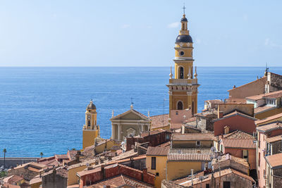 Aerial view of the historic center of menton with the beautiful basilica and blue sea