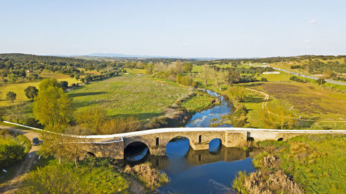 Scenic view of bridge over landscape against sky