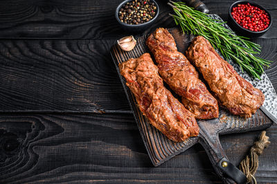 High angle view of meat on barbecue grill