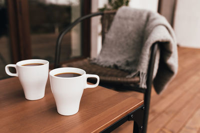 Coffee cup on table at home