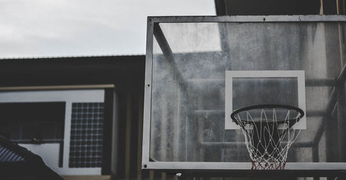 Low angle view of basketball hoop against sky