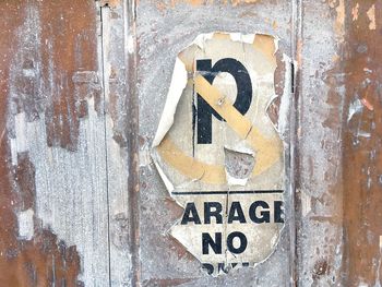 Close-up of text on wood