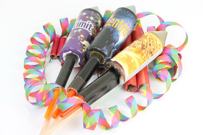 Close-up of colored pencils over white background