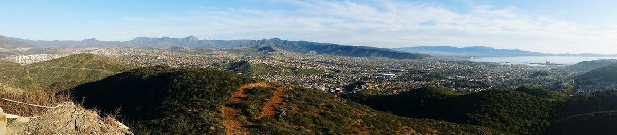 Cityscape with mountain range in background