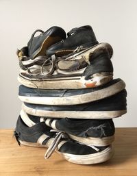 Close-up of shoes on hardwood floor against white background