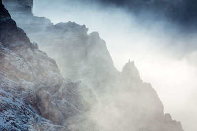 Low angle view of rock formation against sky