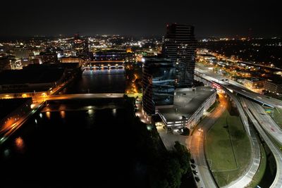 High angle view of illuminated buildings in city at night