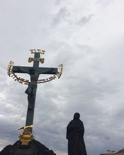 Low angle view of statue against sky