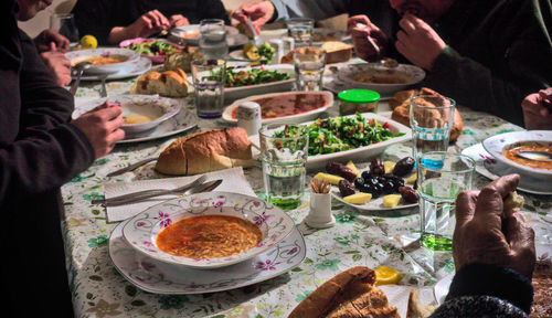 High angle view of people eating food at table