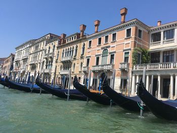 View of boats in canal against buildings