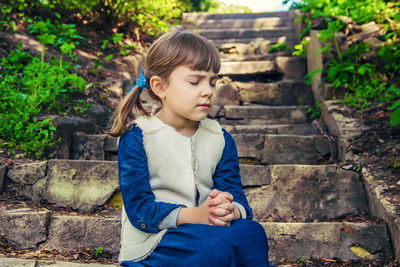 Young woman sitting on steps