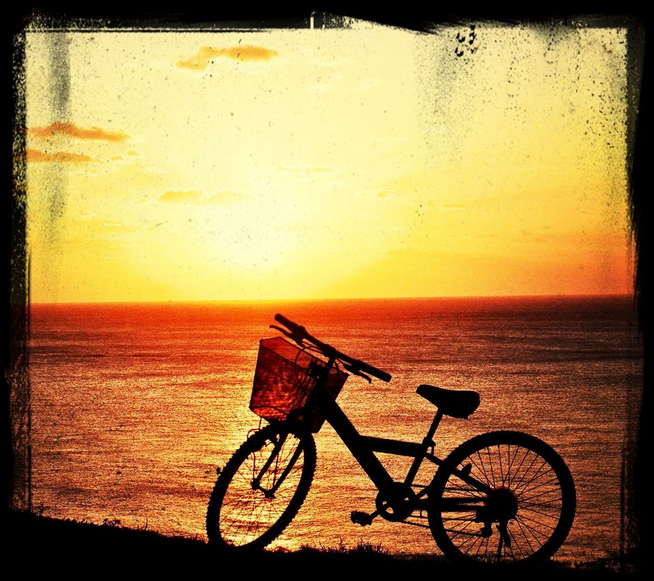 bicycle, sunset, transportation, mode of transport, land vehicle, stationary, orange color, parked, parking, tranquility, beauty in nature, horizon over water, scenics, sky, tranquil scene, sea, absence, silhouette, nature, no people