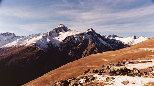 Scenic view of snowcapped mountains against sky