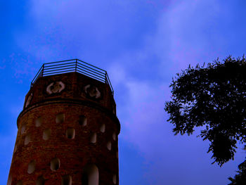 Low angle view of clock tower against sky