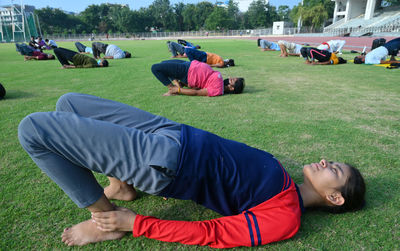 People relaxing on field