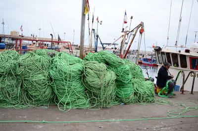 Fishing net on pier at harbor