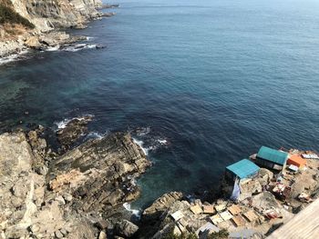 High angle view of rocks by sea