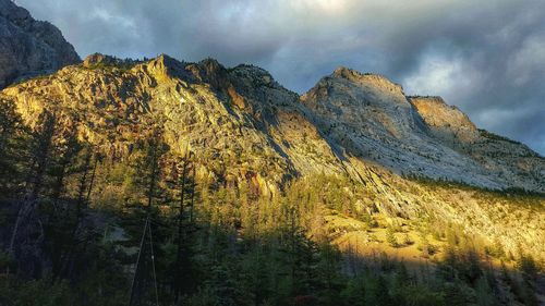 Scenic view of mountains against cloudy sky