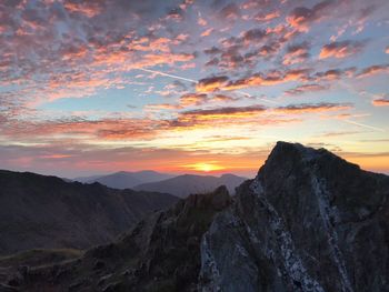 Scenic view of mountains against sky during sunset