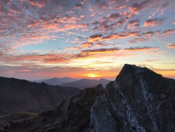 Scenic view of mountains against sky during sunset