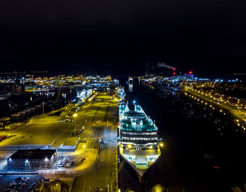 High angle view of illuminated city buildings at night