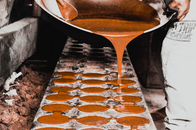 Close-up of coffee beans in glass on table