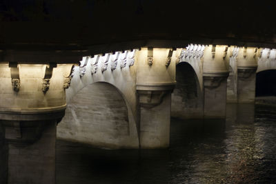 Pont neuf over seine river at night