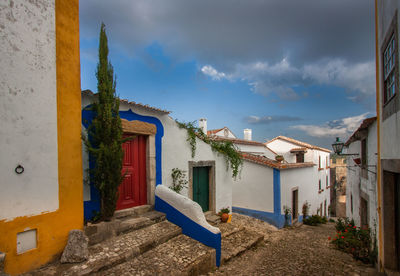 Houses and buildings against blue sky