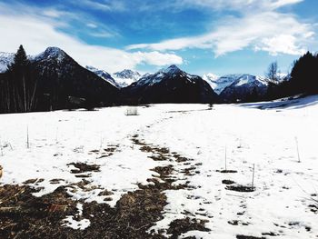 Scenic view of snowcapped mountains against sky