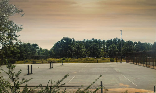 View of empty road against cloudy sky