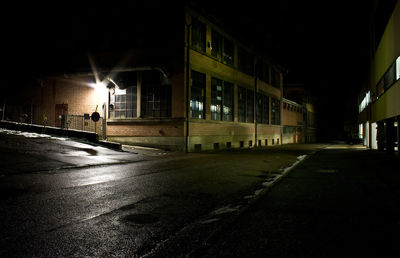 View of illuminated street at night