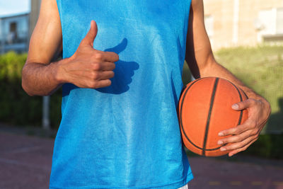 Low section of man playing with ball