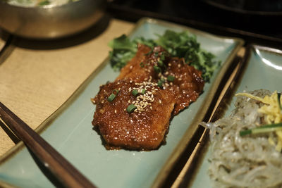 High angle view of meat in plate on table