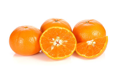 Close-up of oranges against white background