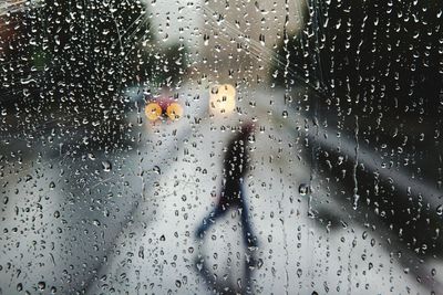 Full frame shot of wet glass window in rainy season