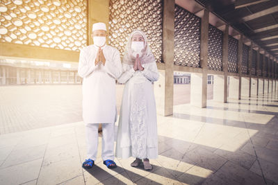 People standing in corridor of building