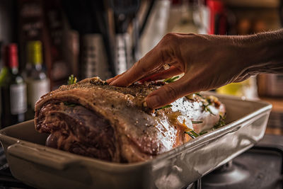 Close-up of person preparing food in kitchen