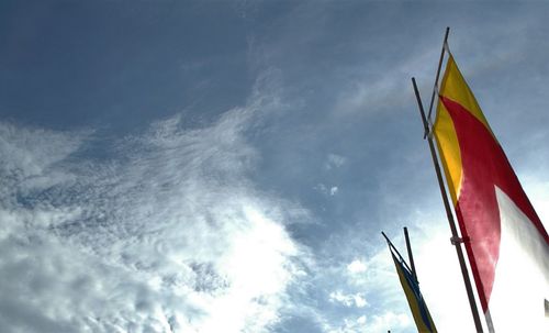 Low angle view of flag against sky