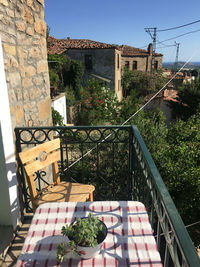 Potted plants on balcony against building