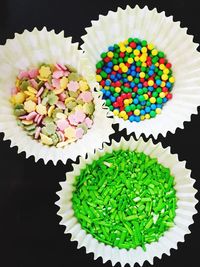 High angle view of cupcakes against black background