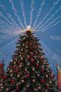 Festive sparkling garlands and shiny decorations with christmas tree as symbol of happy new year 