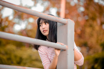 Portrait of woman standing outdoors