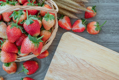 High angle view of strawberries in basket on table