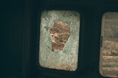 Close-up of rusty car window