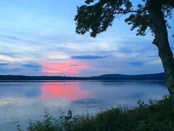 Scenic view of lake at sunset