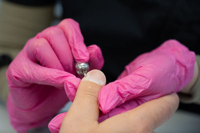 Close-up of hand holding condom