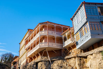 Low angle view of old building against blue sky