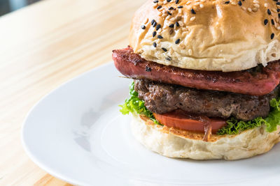 Close-up of burger in plate on table