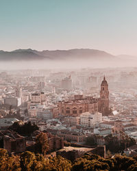 Aerial view of cityscape in foggy weather